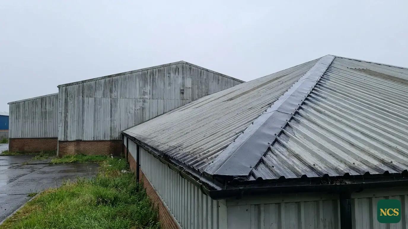 Warehouse roof coating sealing the sheet laps and ridge on a profiled metal roof slope