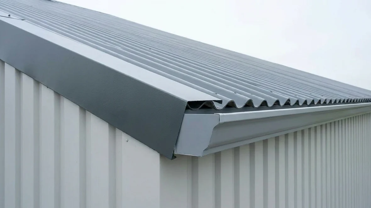 Finished roof edge detail after asbestos roof encapsulation on a grain store near Taunton