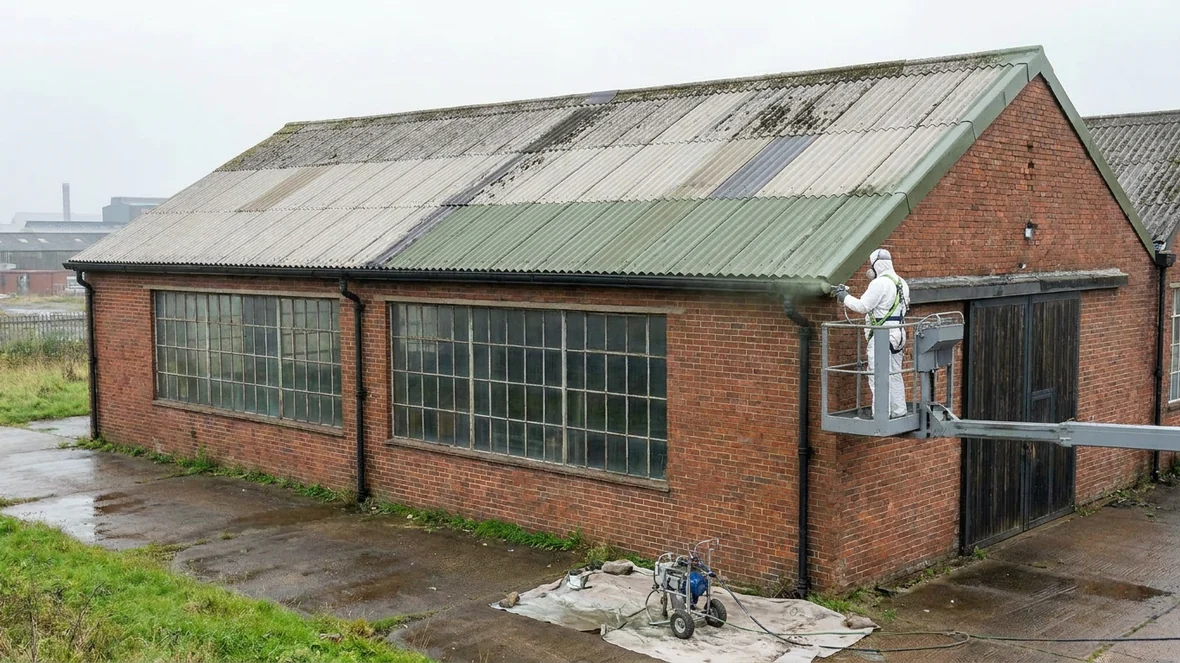 Spraying Olive Green RAL 6003 encapsulation coating on an asbestos roof near Sheffield