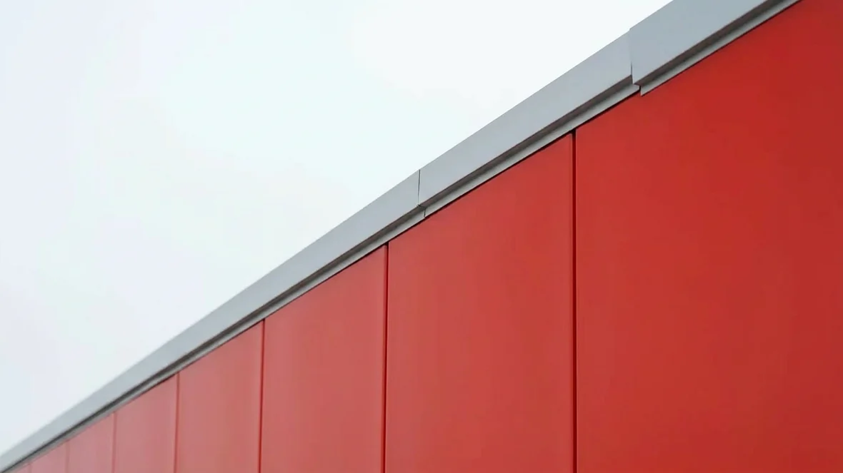 Finished coating detail at the parapet line on a retail unit near Reading