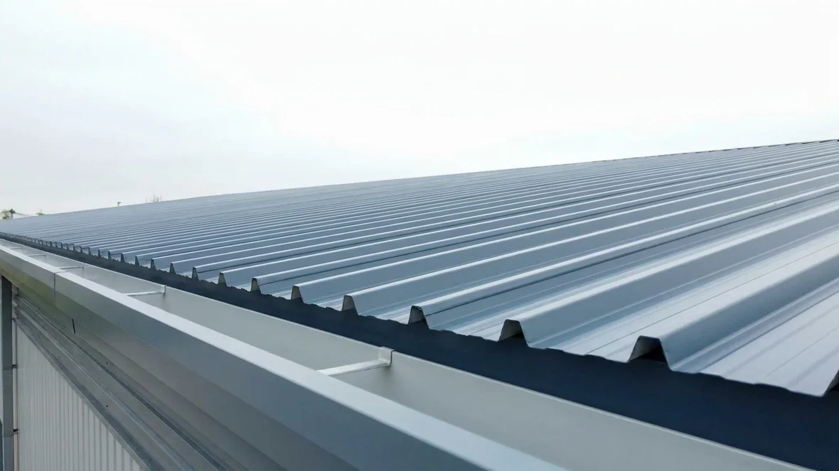 Close-up of coated sheet ends and gutter after cut edge corrosion treatment near Huddersfield