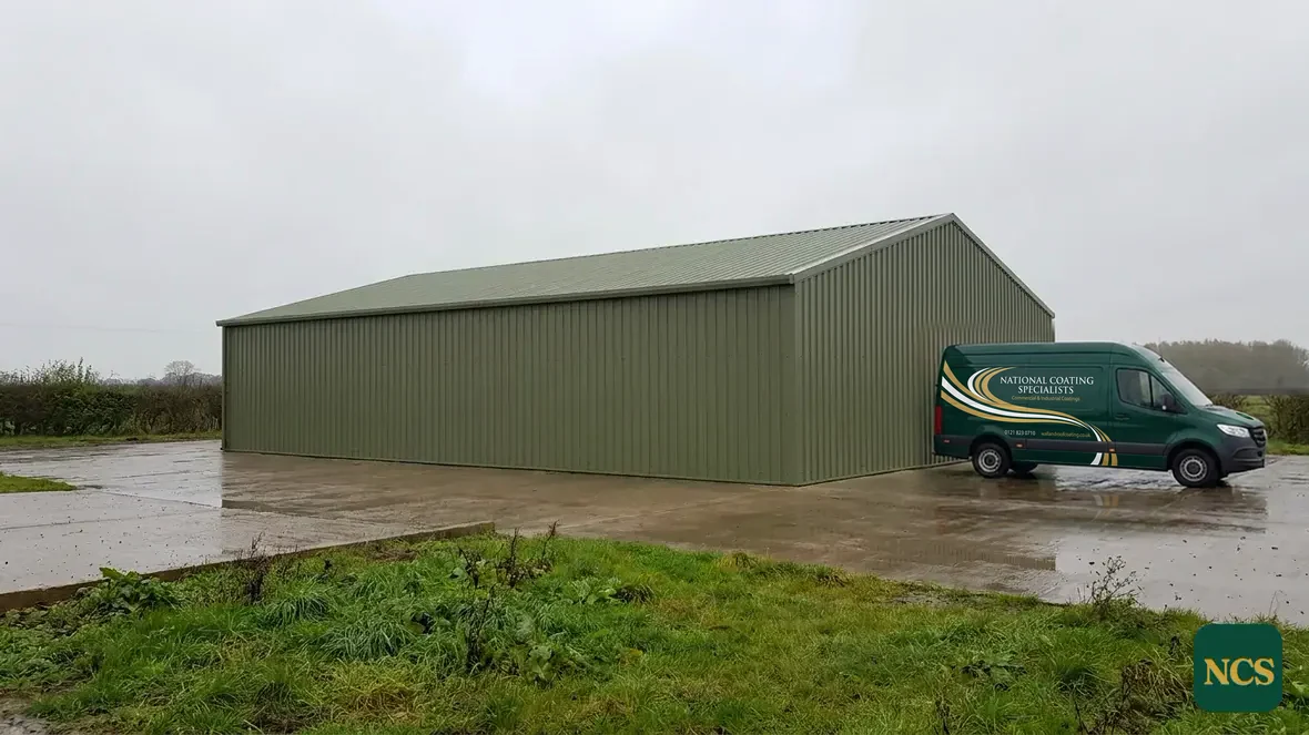 Steel-framed agricultural building coated in olive green RAL 6003