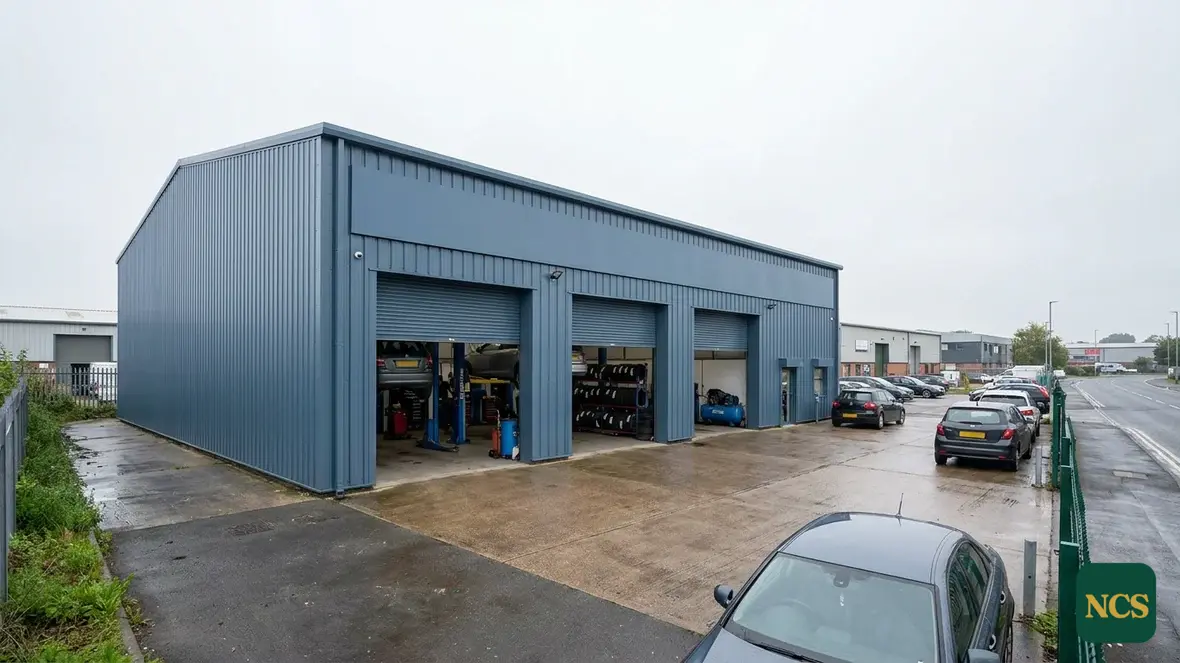 Industrial unit cladding sprayed in slate blue RAL 5008