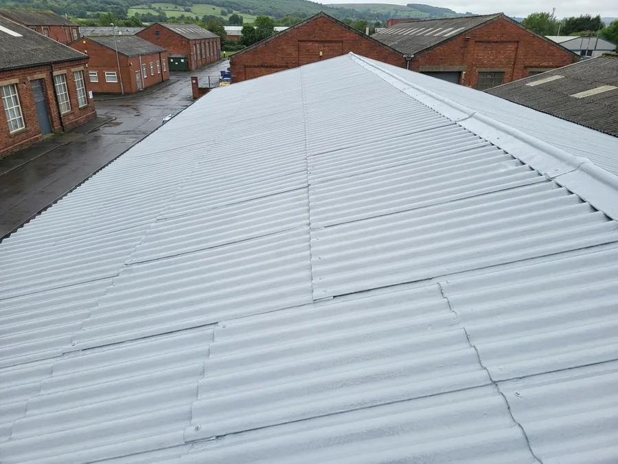 The cleaned and prepared asbestos cement roof of an industrial unit prior to the primer coat application.