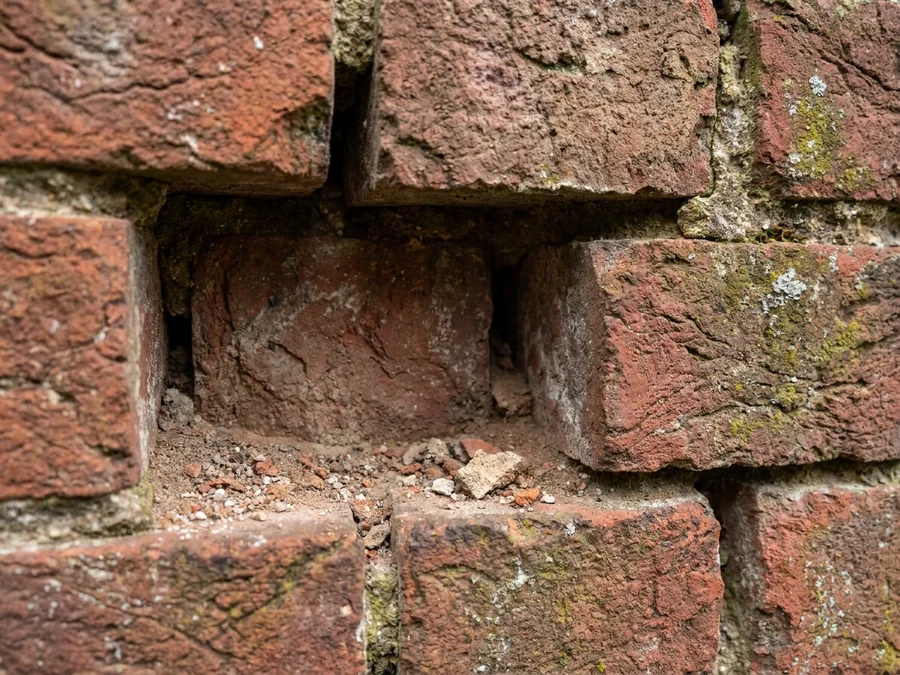 The same wall section after brick replacement and mortar matching.
