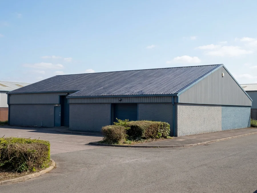 Completed cut-edge corrosion treatment on an industrial building.