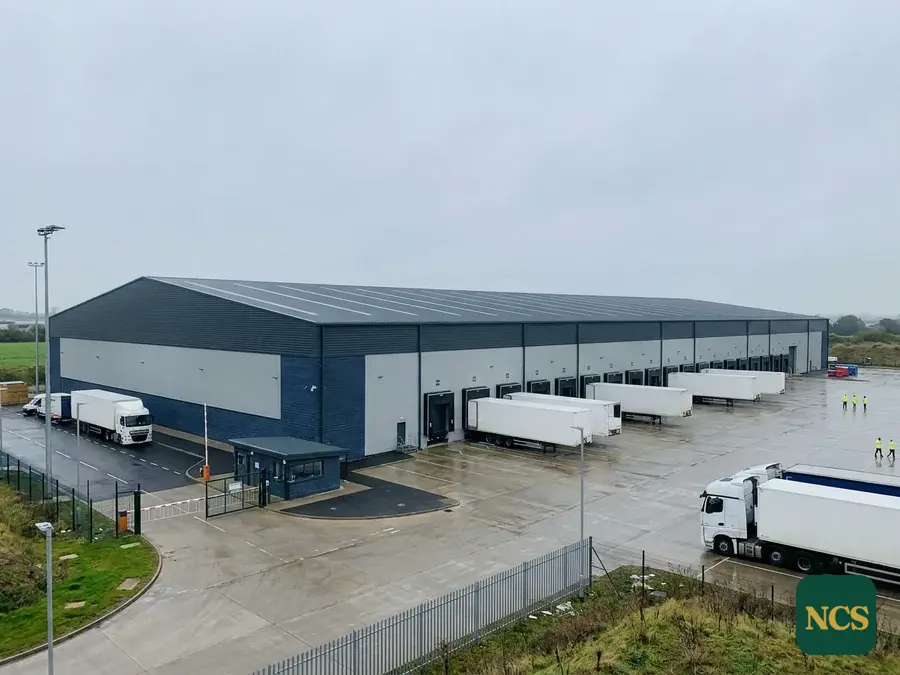 An anthracite roof coating completed on a big-box distribution centre.