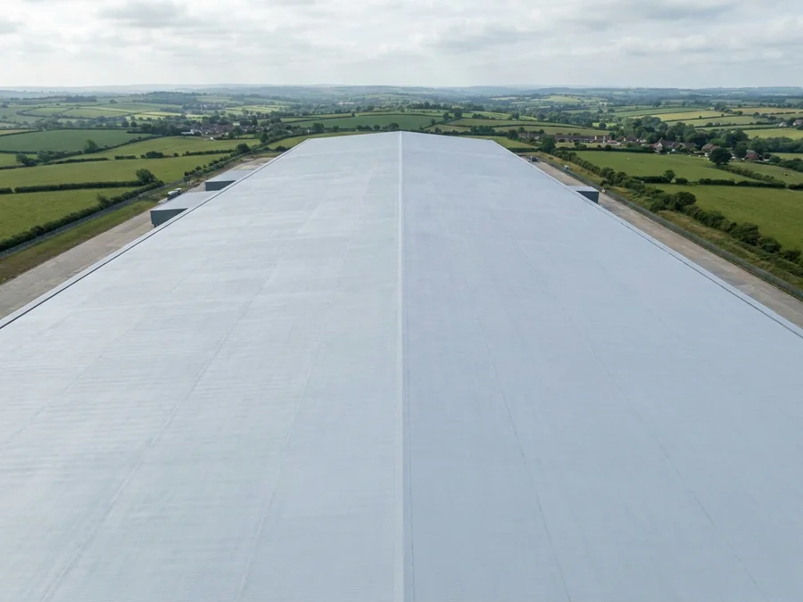 Protective coating applied to a large warehouse roof.