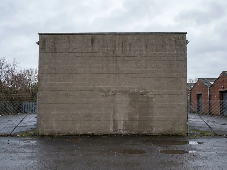 The freshly coated masonry exterior of a UK manufacturing facility.