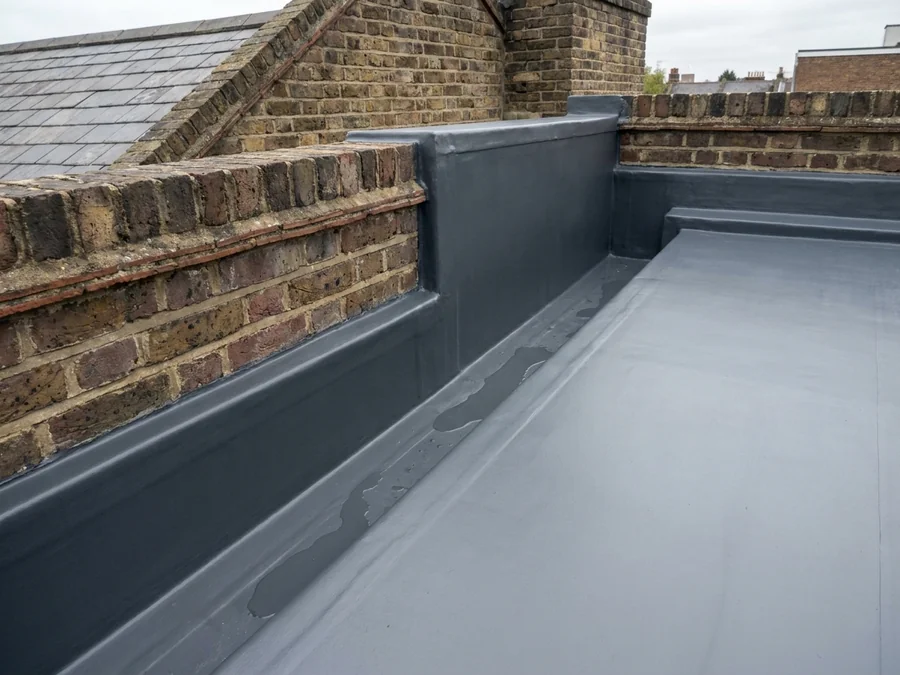Close-up of encapsulated asbestos cement roof sheets after treatment.