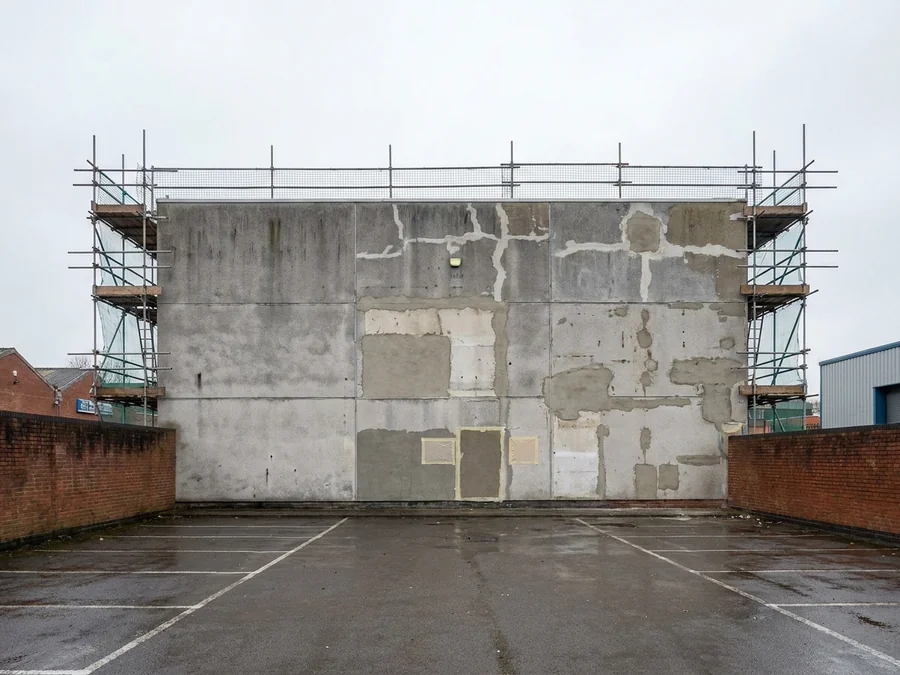 A repaired and recoated agricultural building, showing a uniform and weatherproof finish.